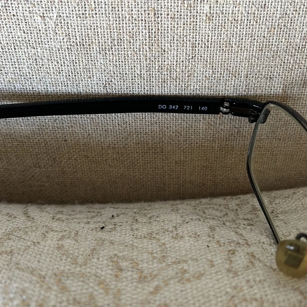 - Dolce and Gabbana black wire frame glasses